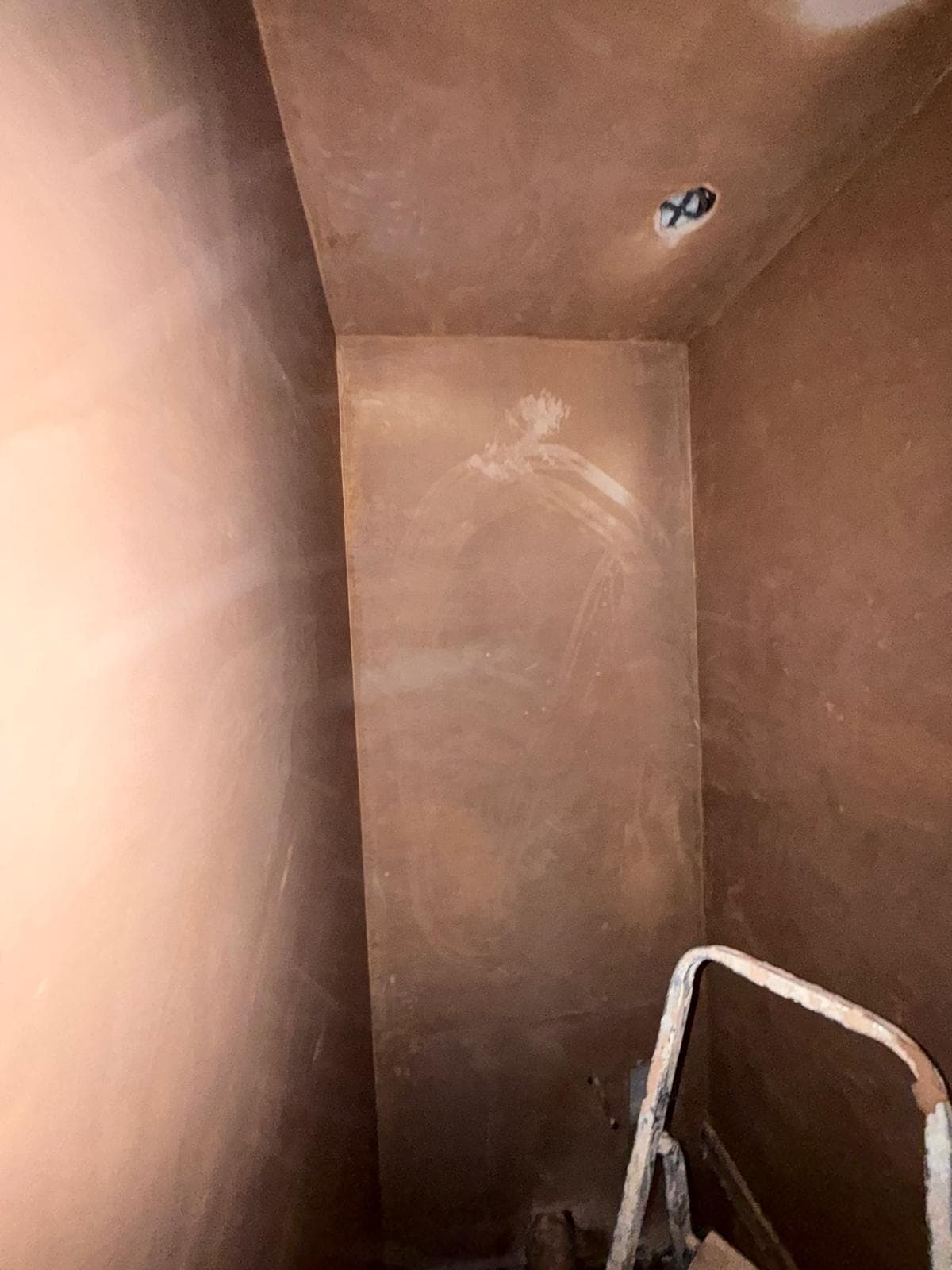 The walls freshly plastered, part way through the rebuild